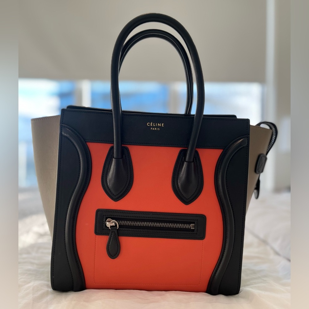 Celine micro luggage tote. Orange with taupe sides and black handle.